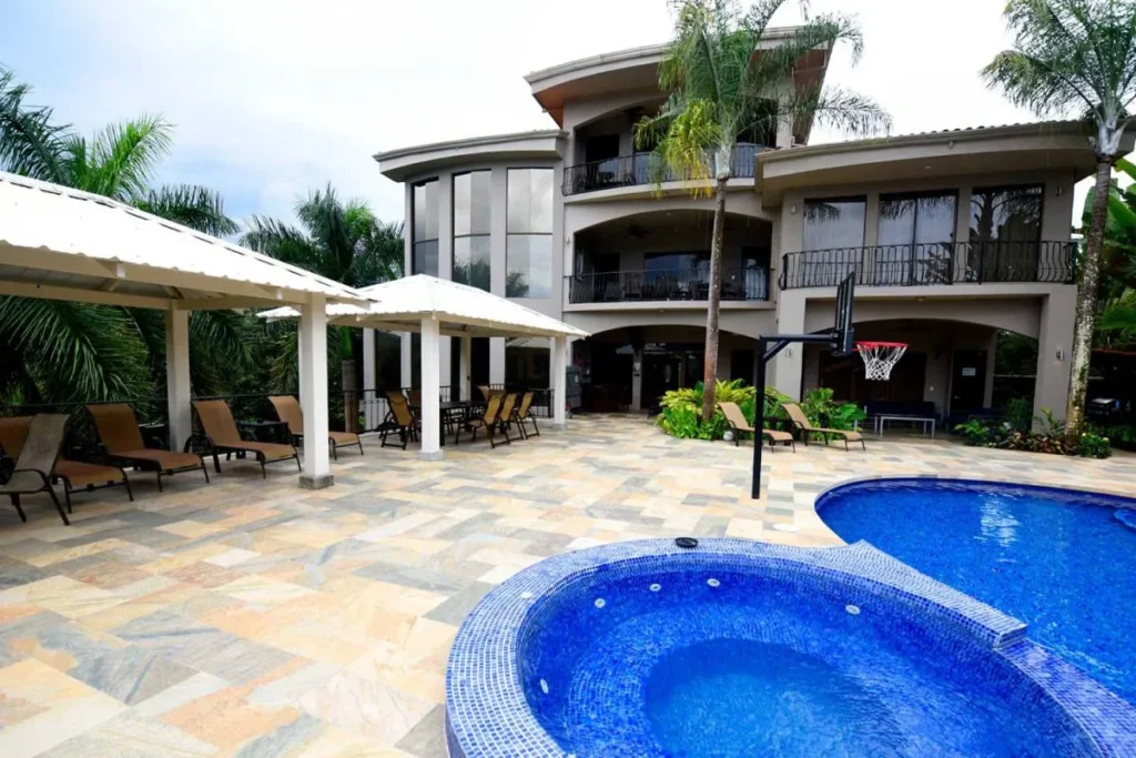 Casa Ponte pools and buildings connected by a footbridge in Jaco
