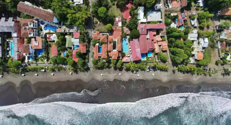 Drone view of beachfront vacation rentals in Jaco, Costa Rica