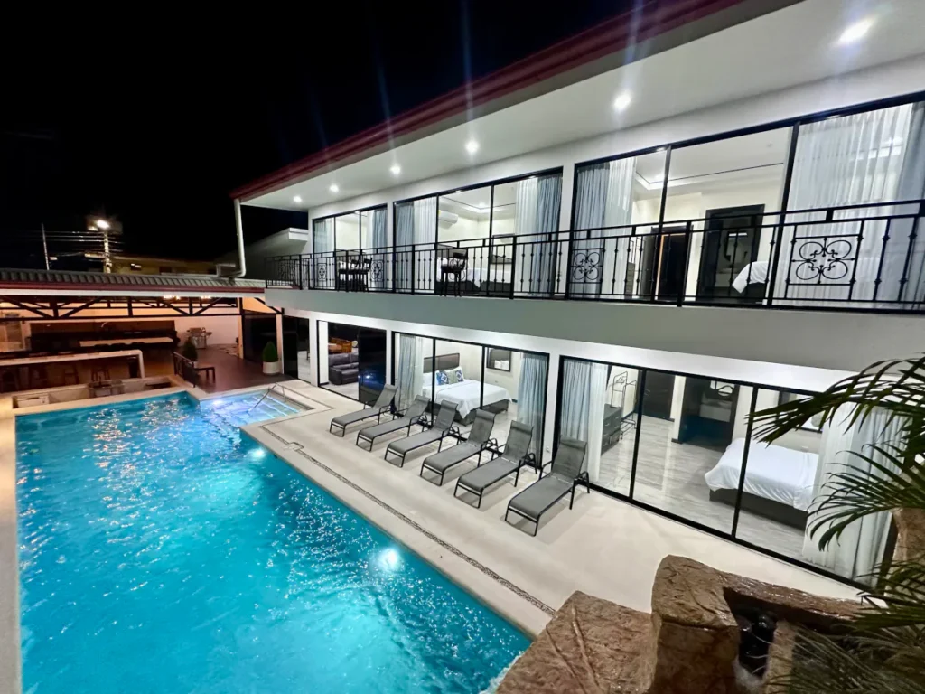 Ocean Breeze Villa pool with swim-up bar and waterfall in Jaco