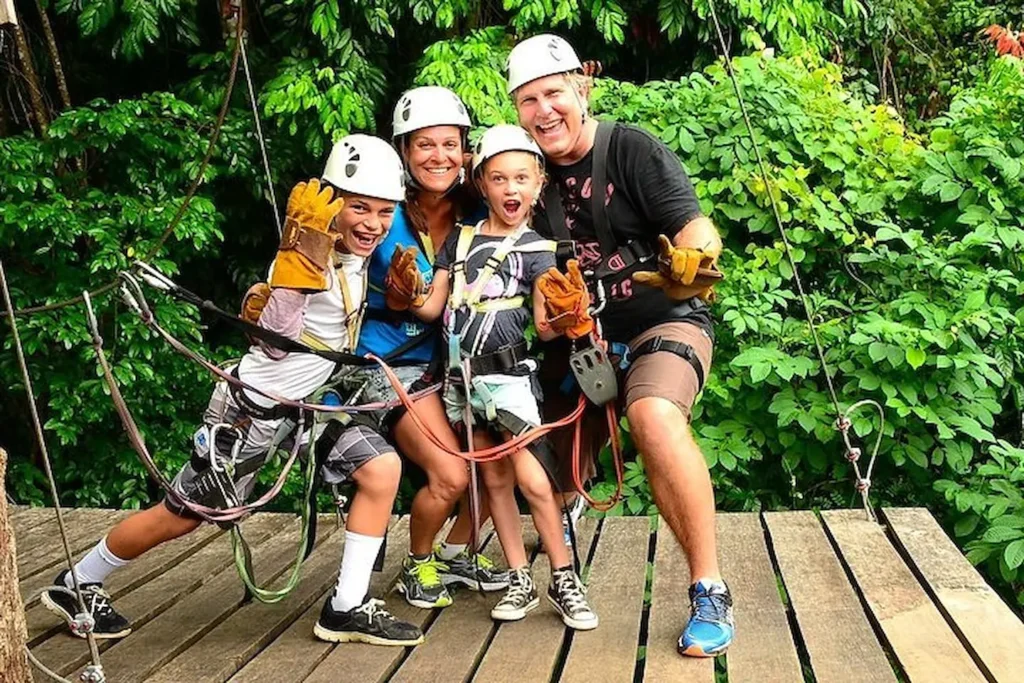 Family with kids ready for a zipline canopy tour near Jaco, Costa Rica
