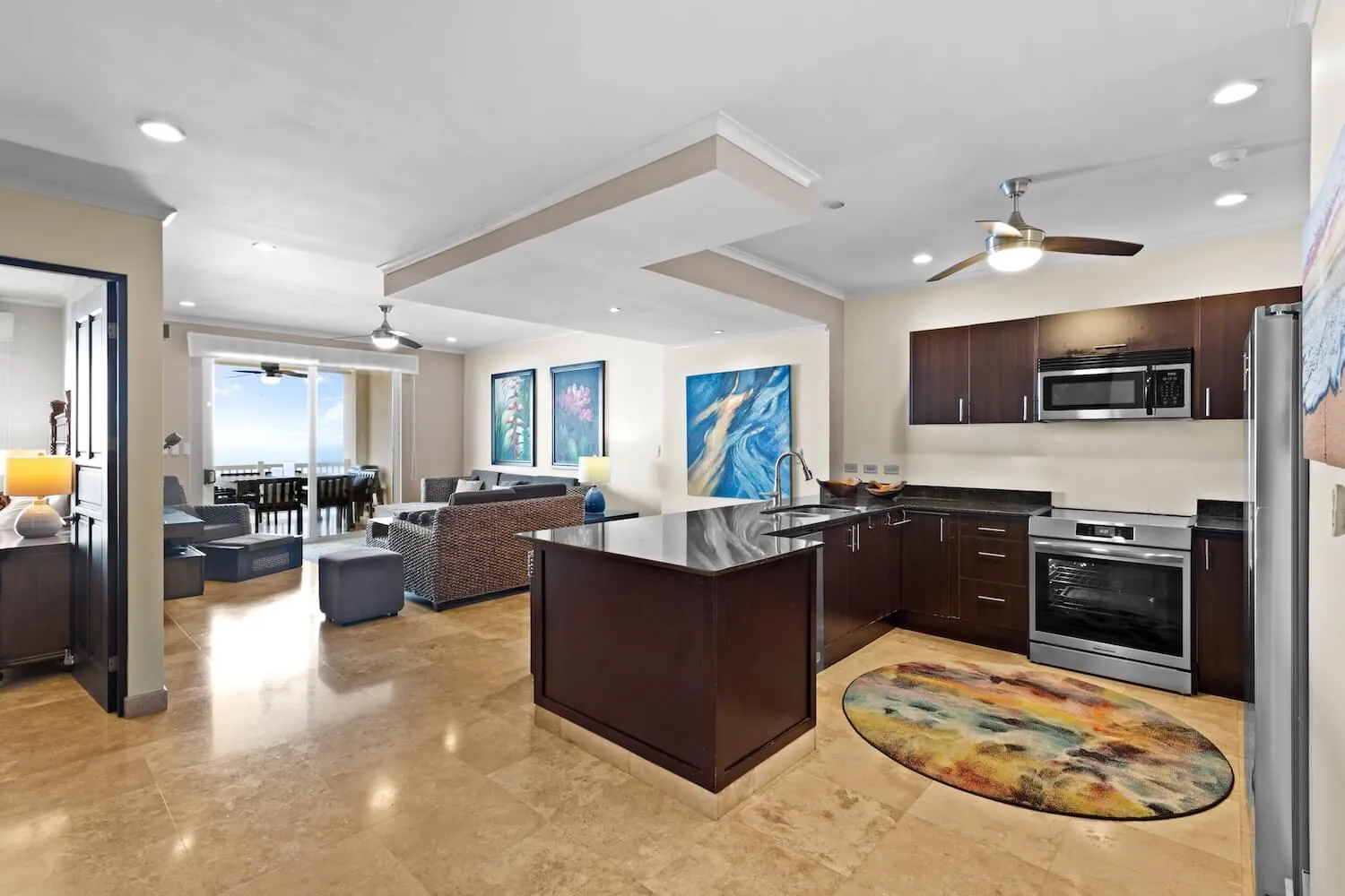 Open kitchen and living room inside a condo at The Palms