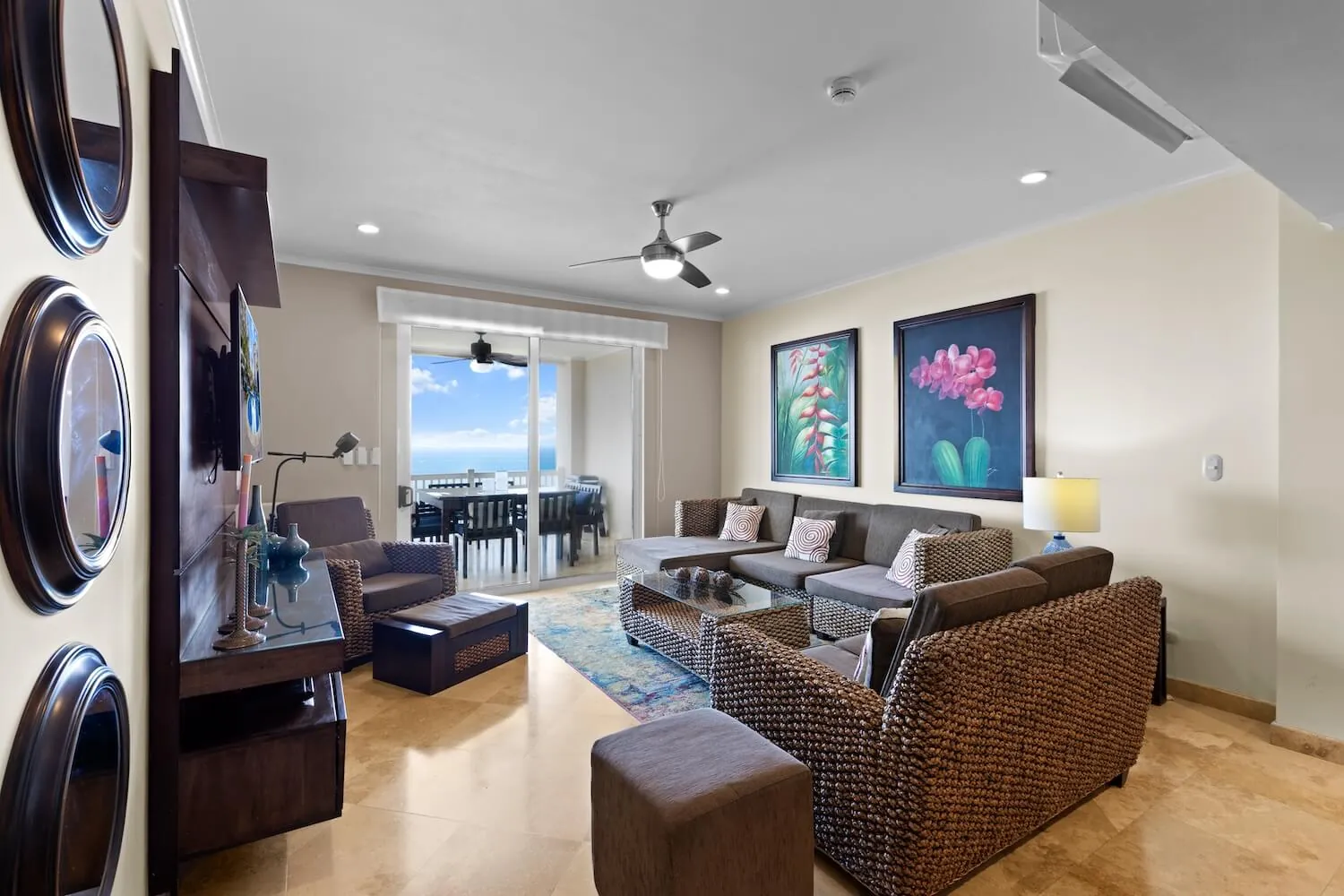 Living room at The Palms 1002 opening onto the ocean-view balcony