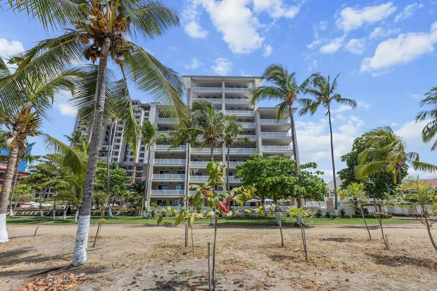 The Palms beachfront tower seen from the sand on the north end of Jaco Beach