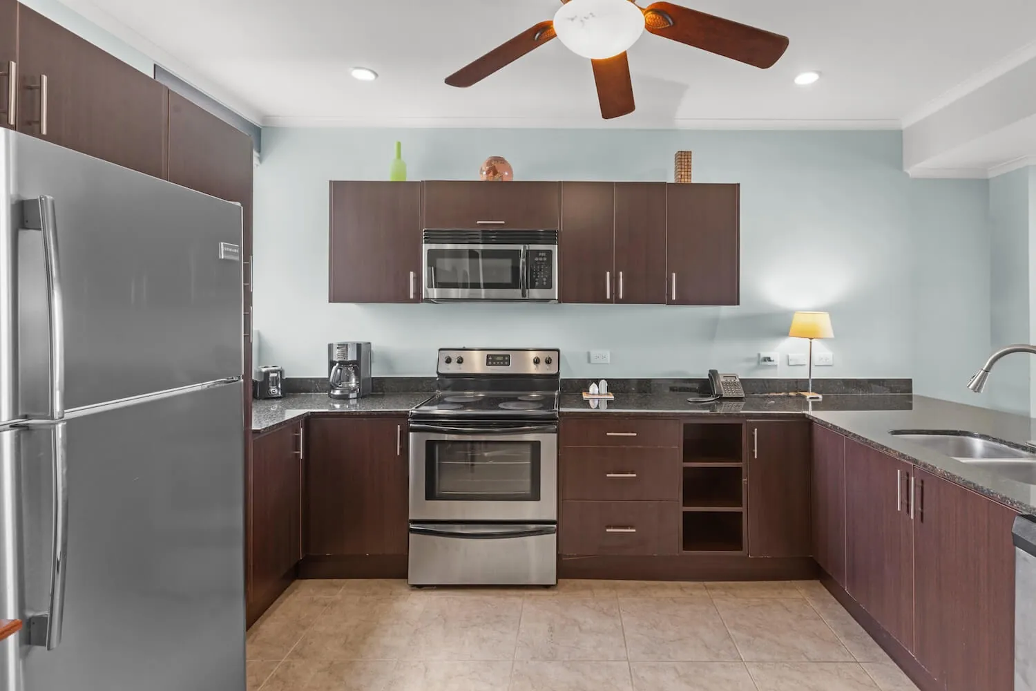 Kitchen with stainless appliances at The Palms 304