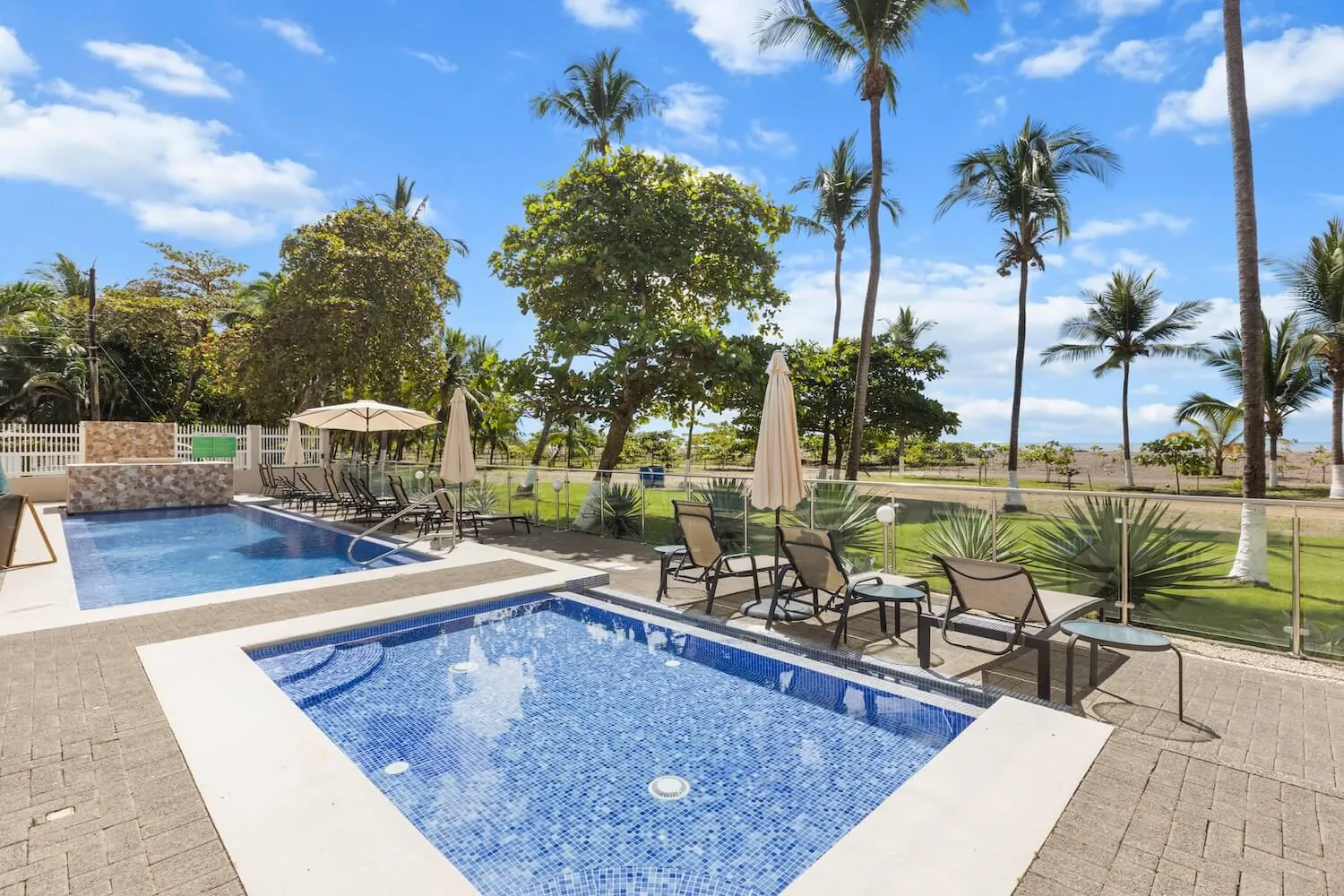 The Palms beachfront pools beside the sand