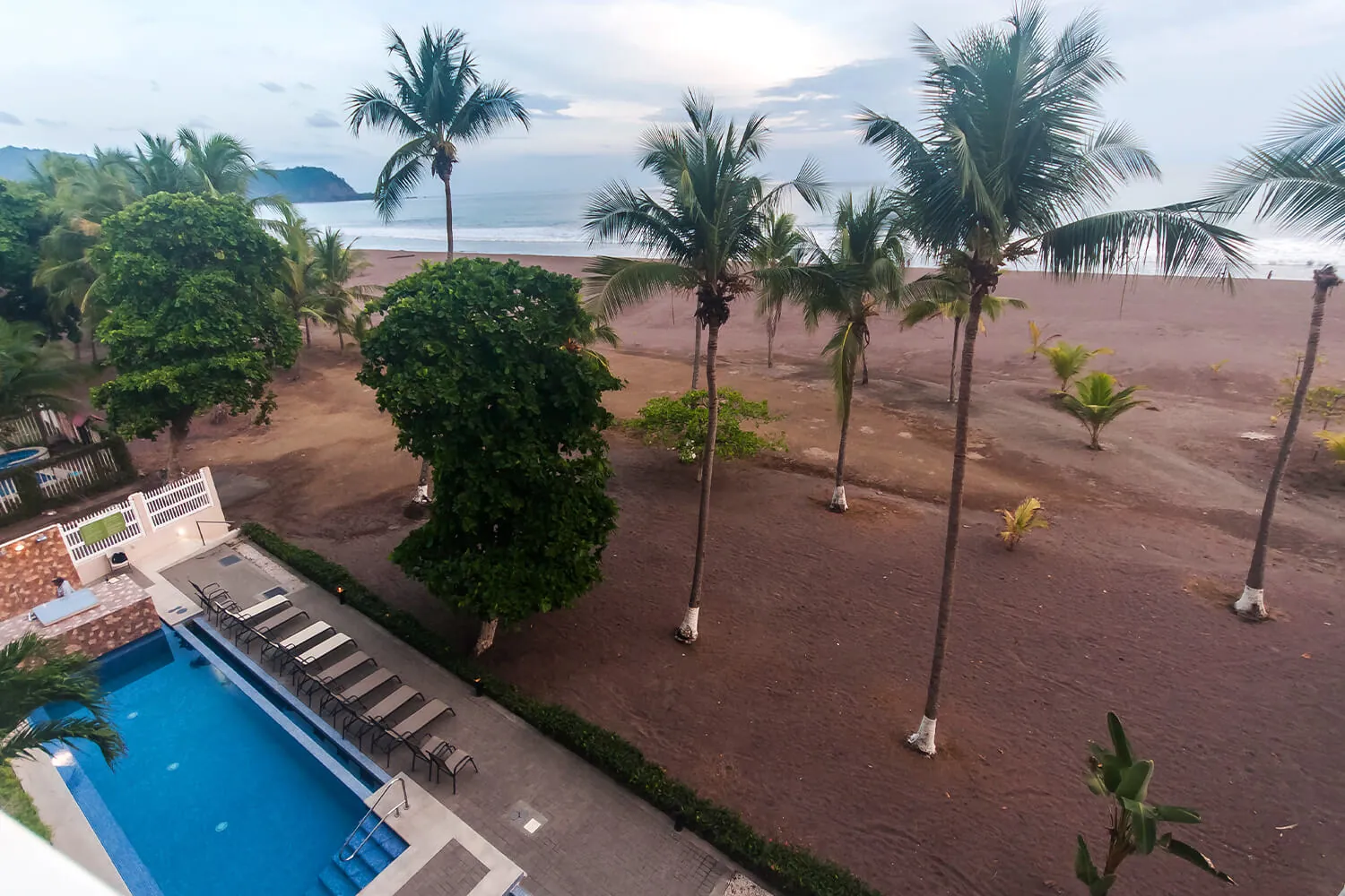 The Palms pool and the beach seen from the fourth floor
