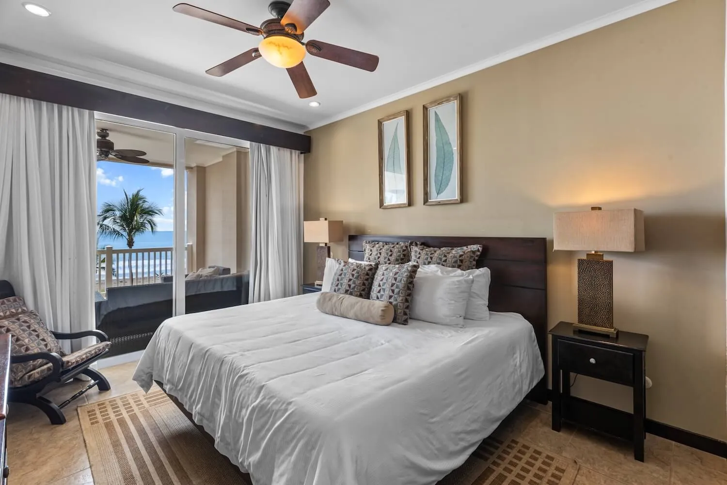 Primary bedroom with king bed at The Palms 404