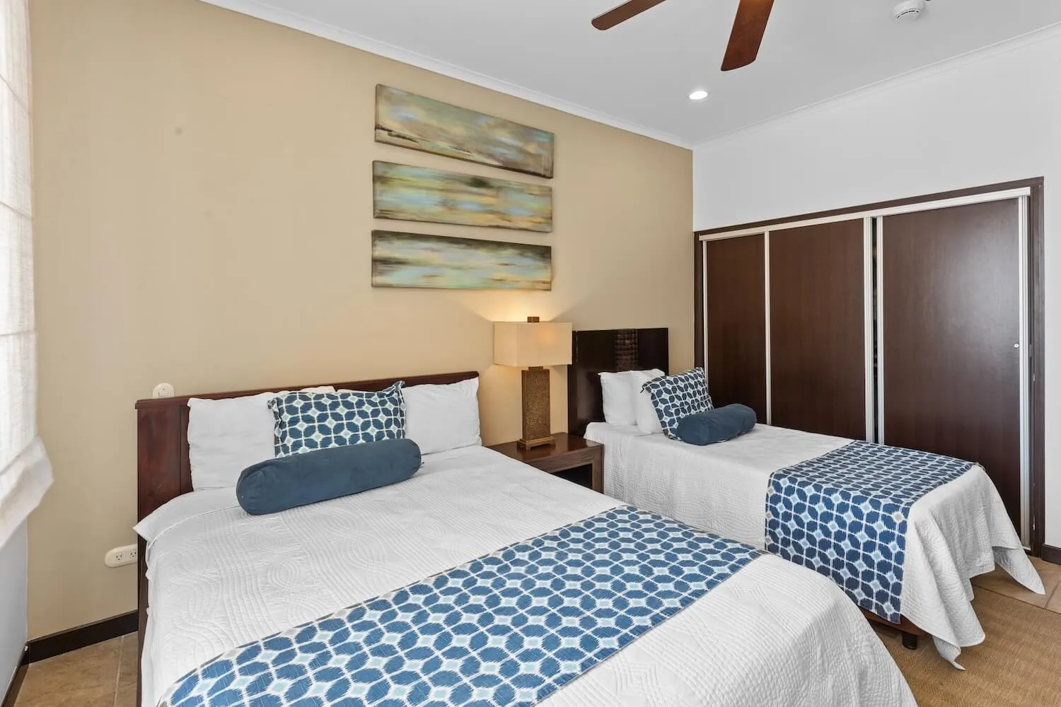 Second bedroom at The Palms 404 with a queen bed and a single bed