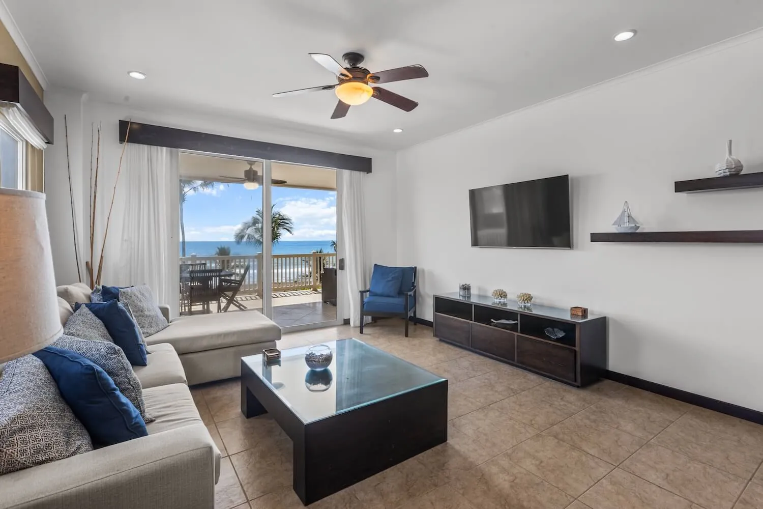 Living room at The Palms 404 with sofa and balcony doors