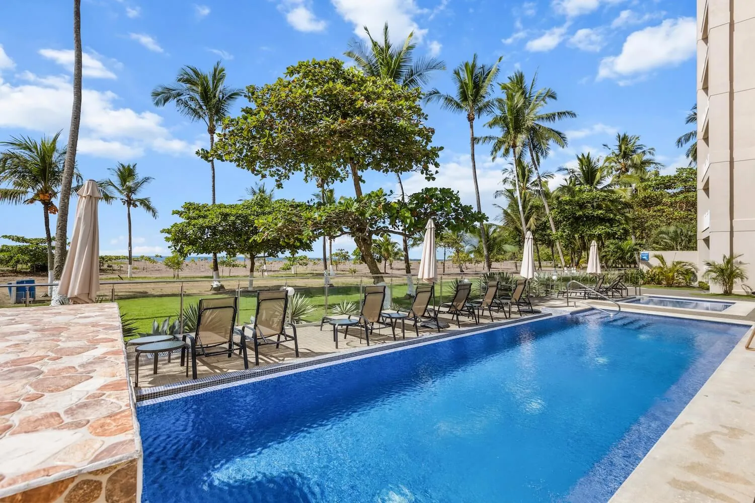 The Palms beachfront pool next to the sand