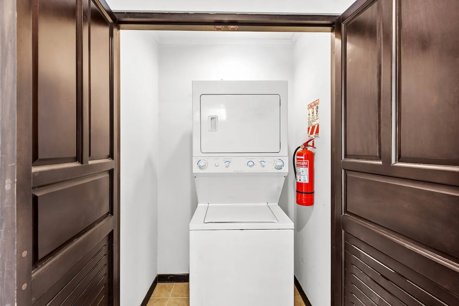 Stackable washer and dryer inside The Palms 504