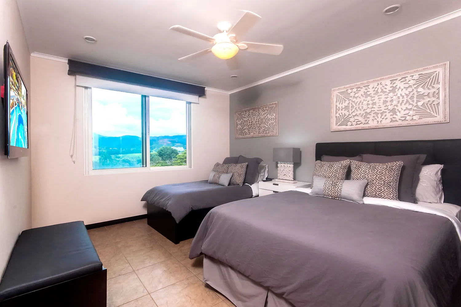 Second bedroom at The Palms 704 with a queen bed and a single bed