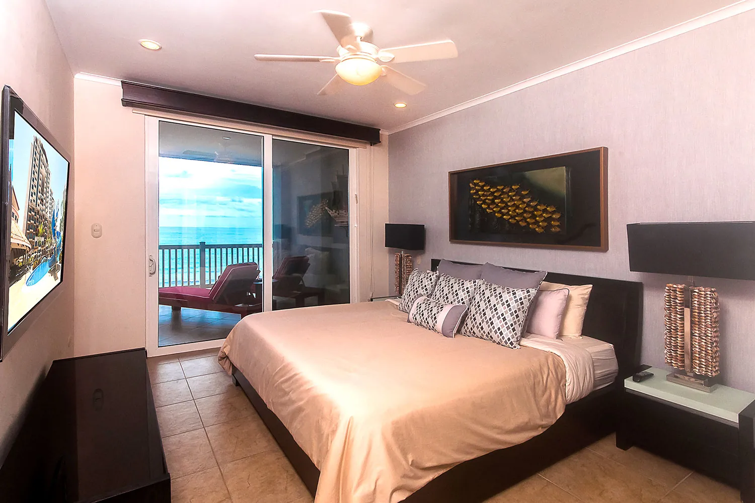 Primary bedroom at The Palms 704 with balcony doors