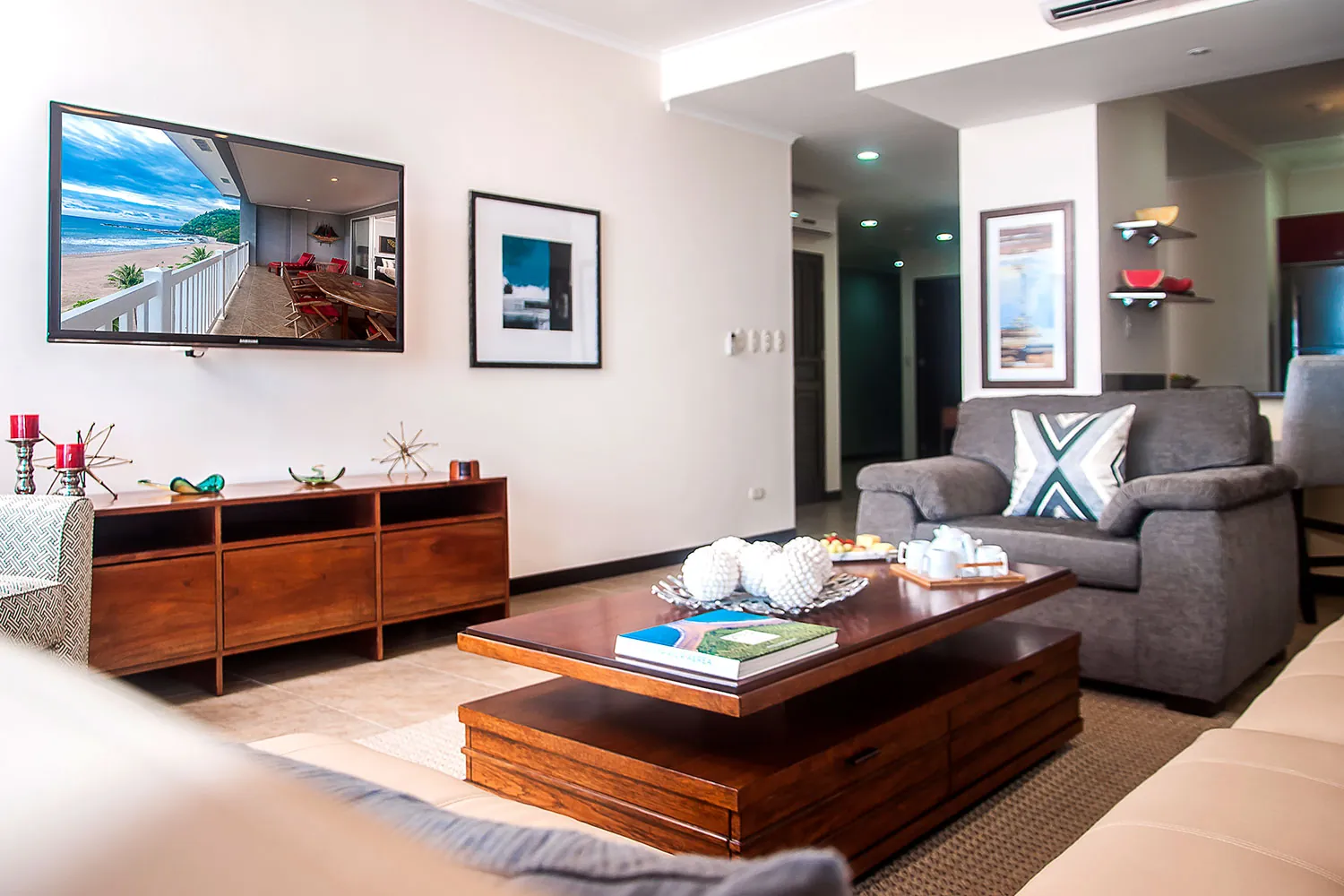 Living room at The Palms 704 with sofas and wall TV