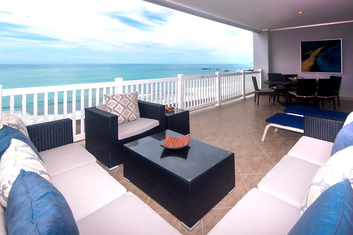 Outdoor seating on the balcony of The Palms 902