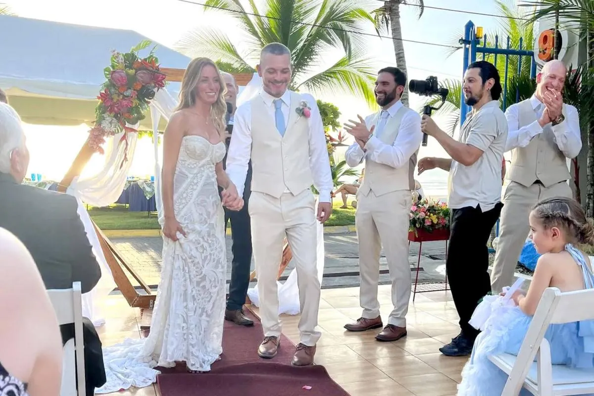 Newlyweds celebrating with guests at a destination wedding in Jaco
